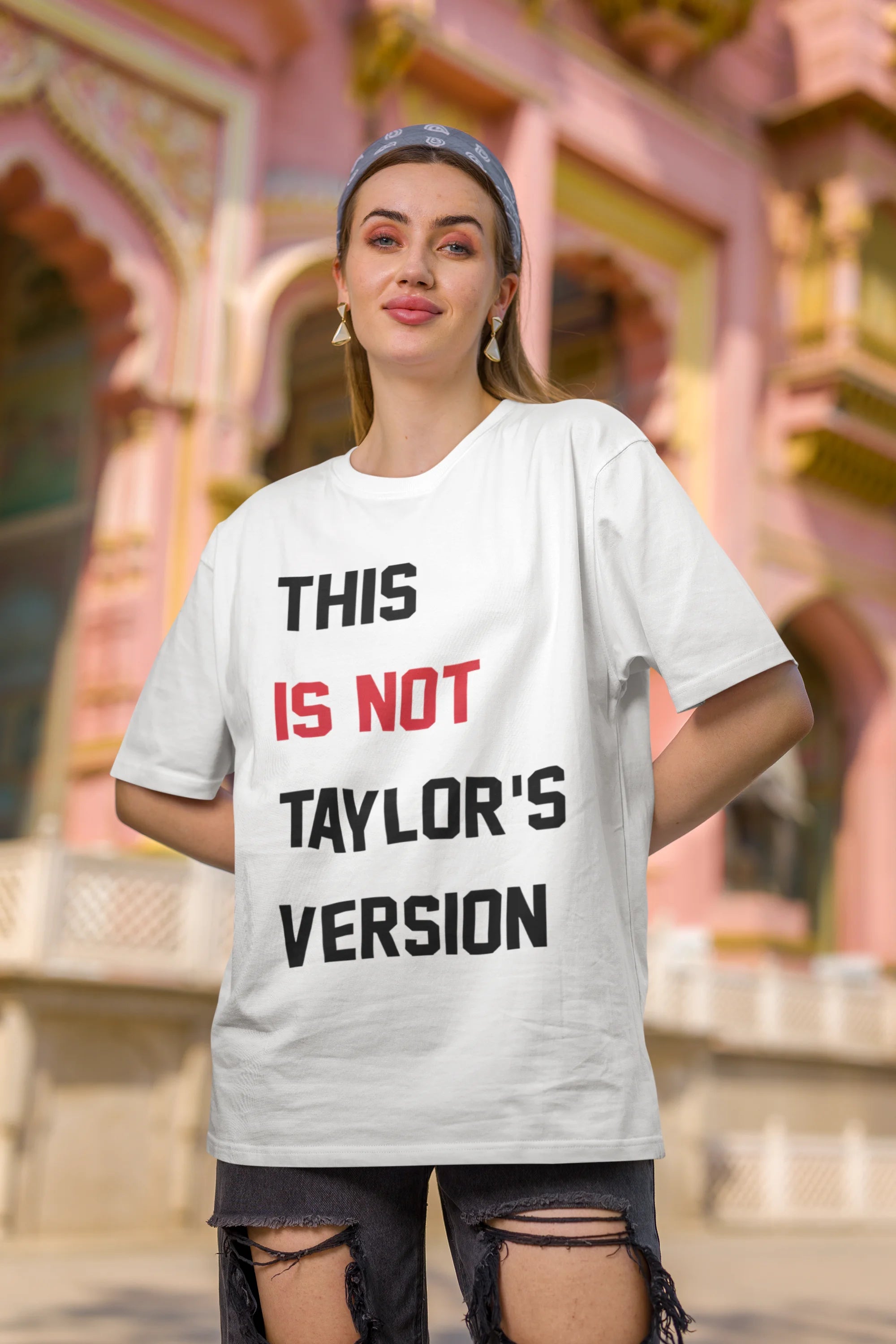 Second image of Woman wearing Taylor Swift Red-themed oversized tee, showcasing iconic eras tour merch and Taylor's Version nod