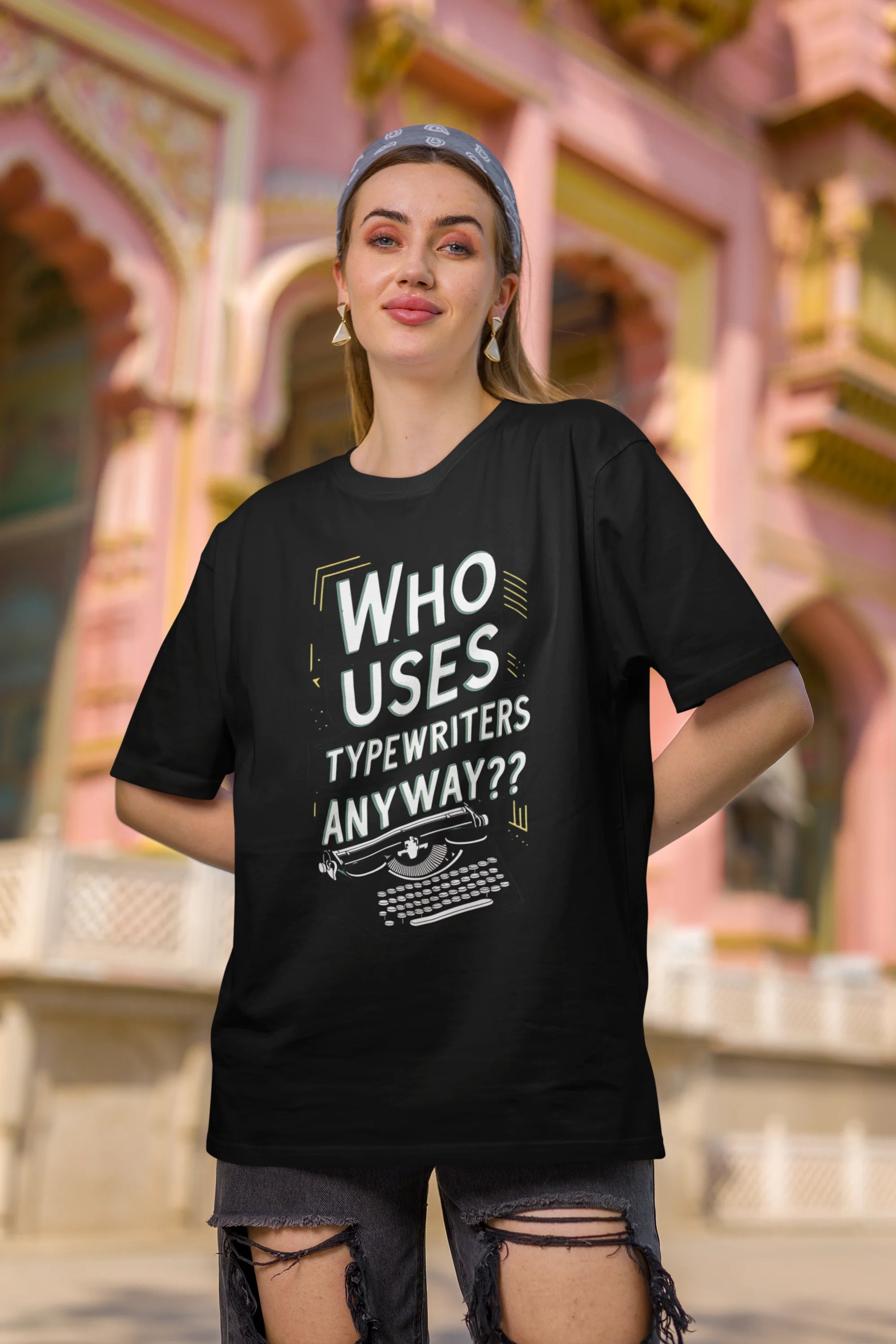 Second Image of a woman wearing black Oversize t-shirt featuring TTPD design inspired by Taylor Swift's Eras Tour.