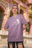 First image of woman wearing dirty purple coloured Oversized Taylor Swift T-Shirt featuring TTPD design.