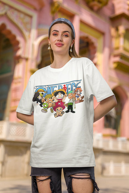 First front view of a female model wearing an off-white oversized t-shirt featuring chibi versions of the Straw Hat Crew from the One Piece anime.