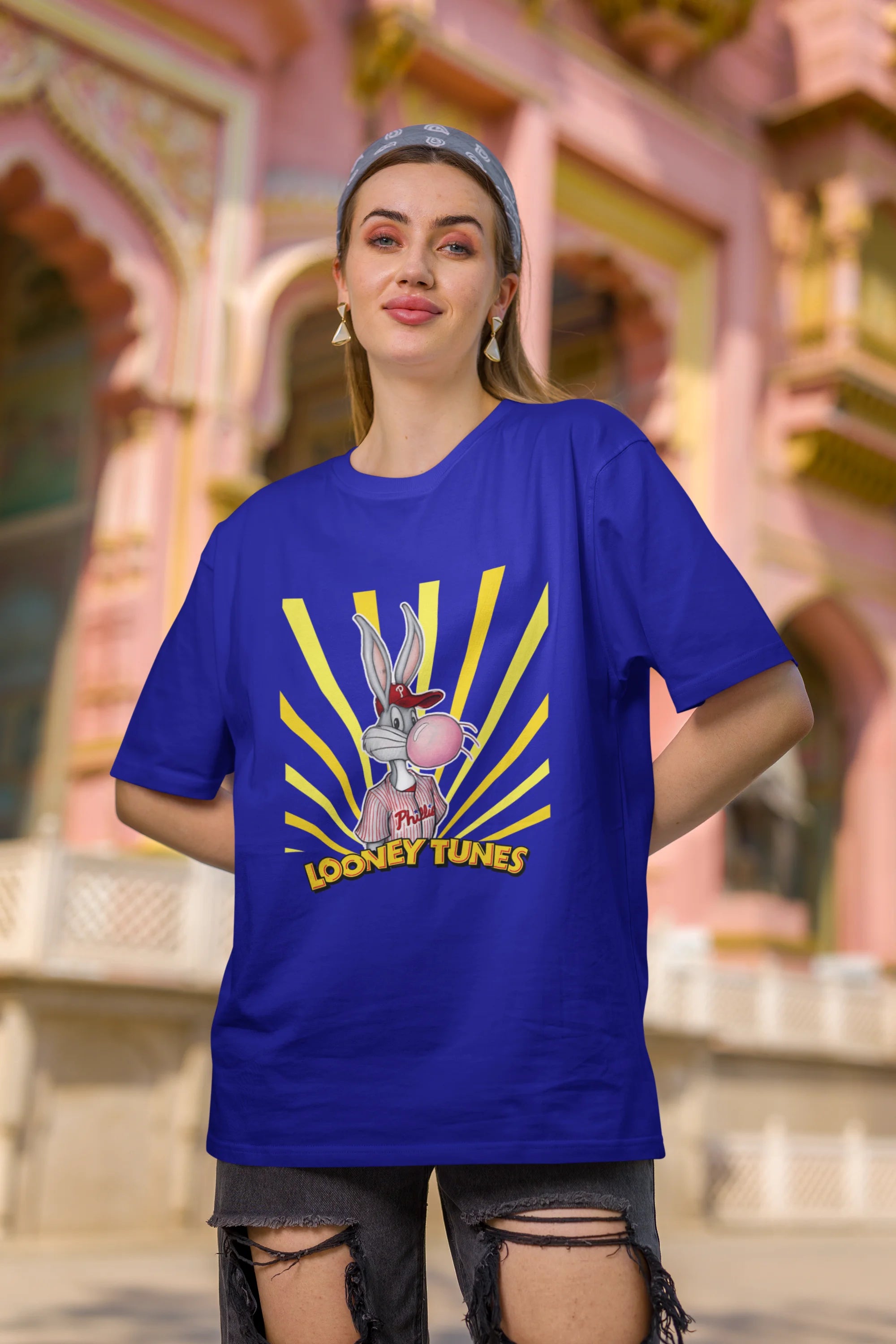 Second image of female Model showcasing blue Bugs Bunny oversize t-shirt from Looney Tunes, featuring a bold Bugs Bunny design