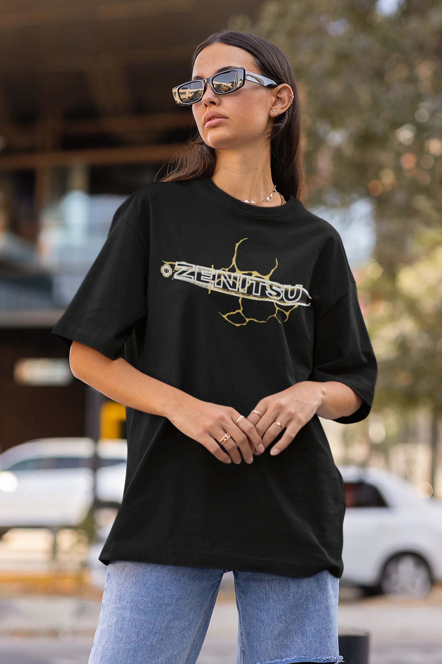 First front view of a female model wearing a black oversized t-shirt featuring Zenitsu Agatsuma with the text "High Voltage".