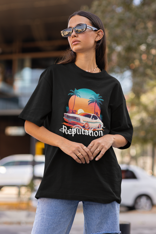 Side view of woman wearing black Oversize t-shirt featuring Reputation Taylor's Version design inspired by Taylor Swift's Reputation era
