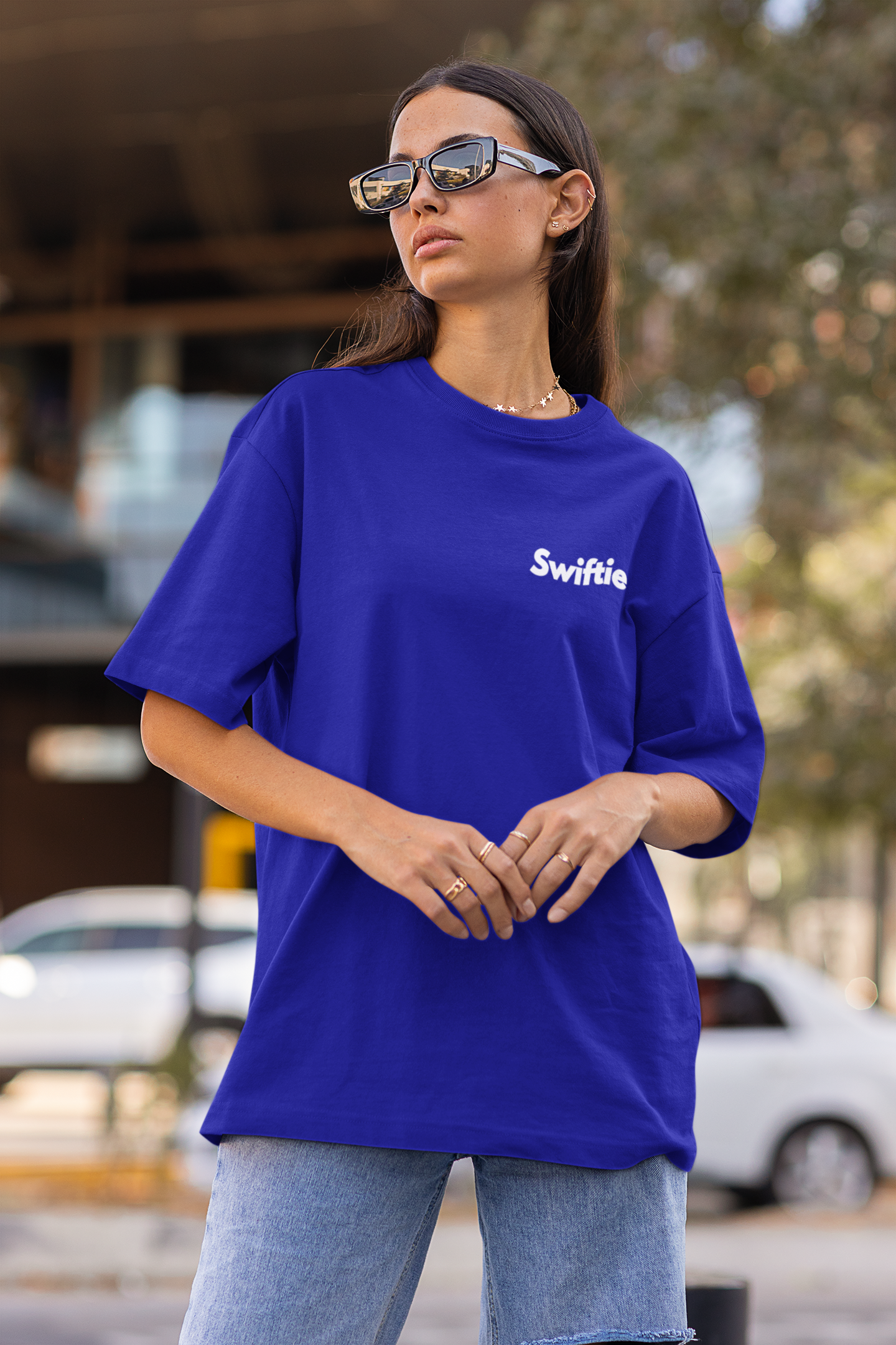 Side view of model showcasing Taylor Swift-inspired Oh Oh design blue oversized t-shirt from Swiftie Collection