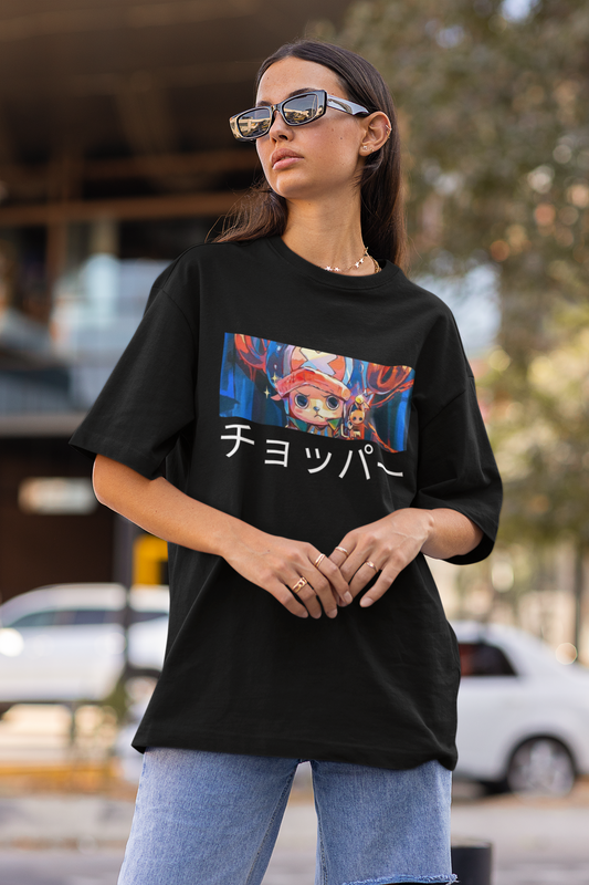 First front view a female model wearing a black oversized t-shirt featuring Tony Chopper from the One Piece anime.