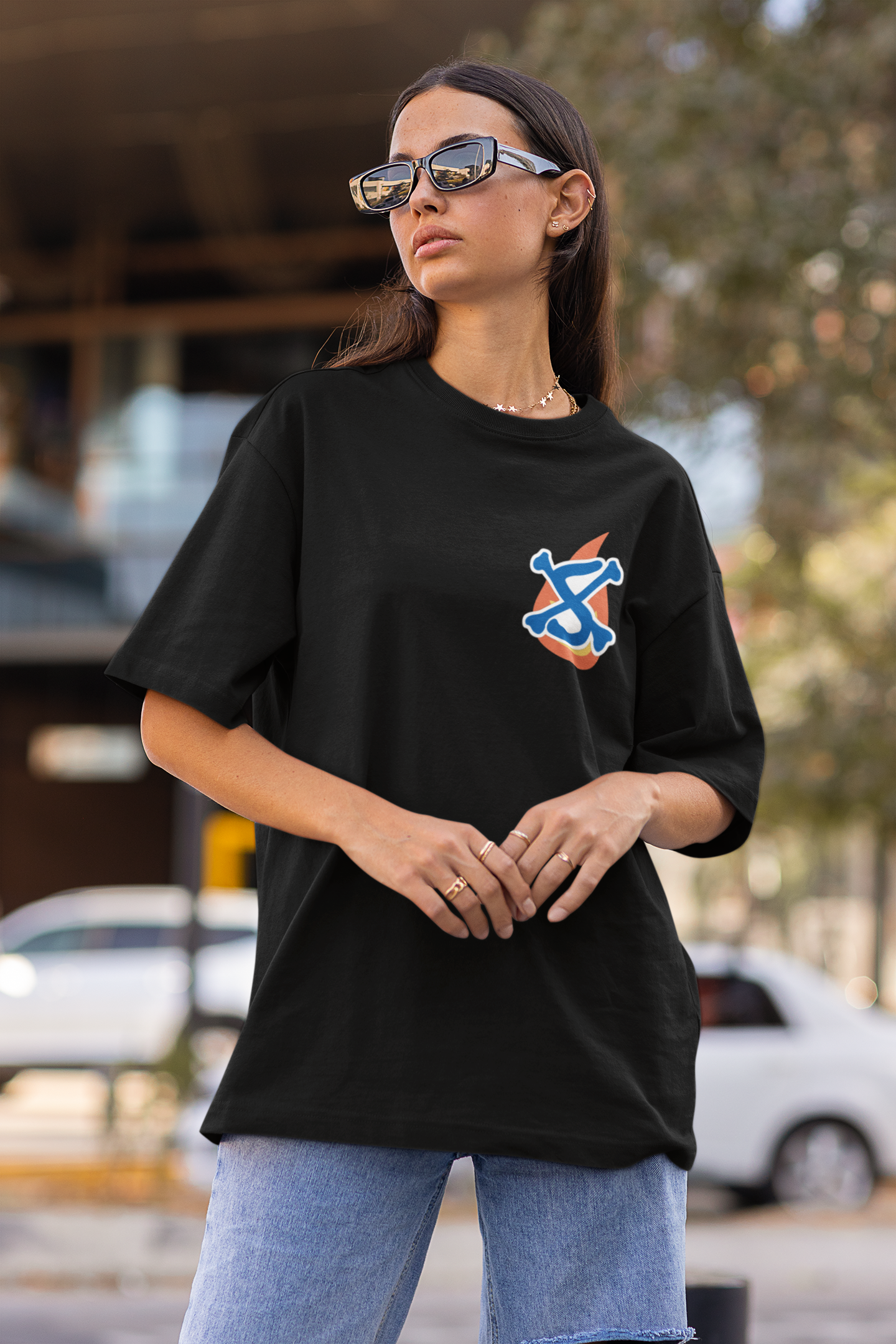 First front view of a female model wearing a black oversized t-shirt featuring Sabo with the text "Flame Emperor."