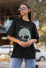 Side view of female model showcasing black oversized t-shirts inspired by Hakuna Matata from Disney's Lion King, featuring Pumbaa, Simba and other iconic characters.