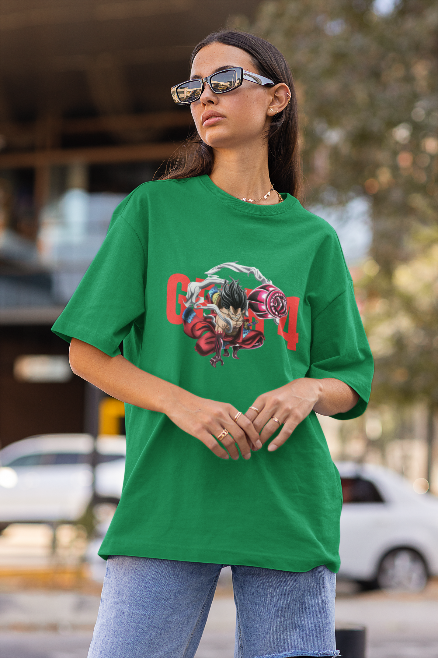 First front view of a female model wearing a forest green oversized t-shirt featuring Luffy in his Gear 4 Bounceman form from the One Piece anime.