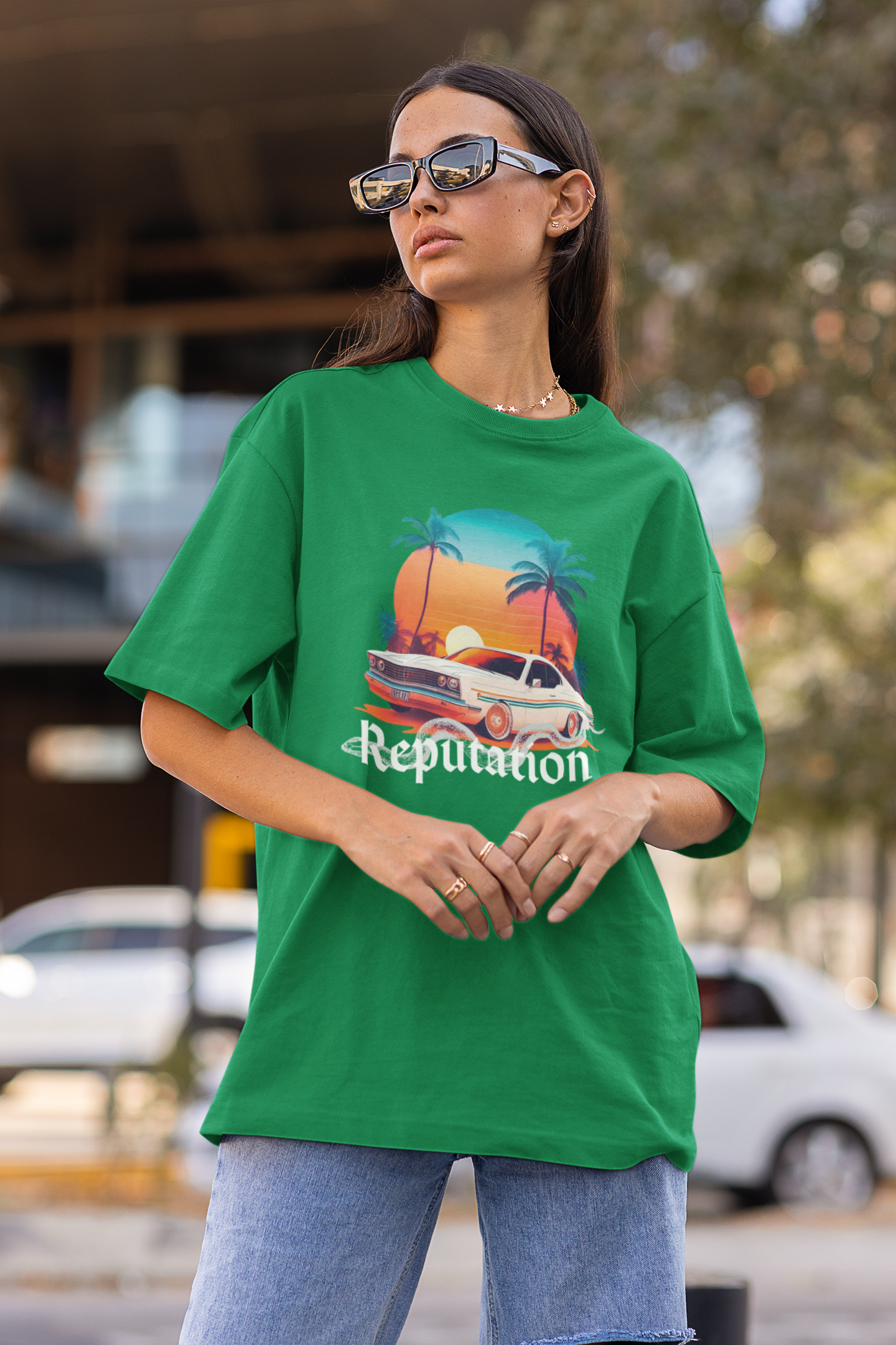 Side view of woman wearing green Oversize t-shirt featuring Reputation Taylor's Version design inspired by Taylor Swift's Reputation era