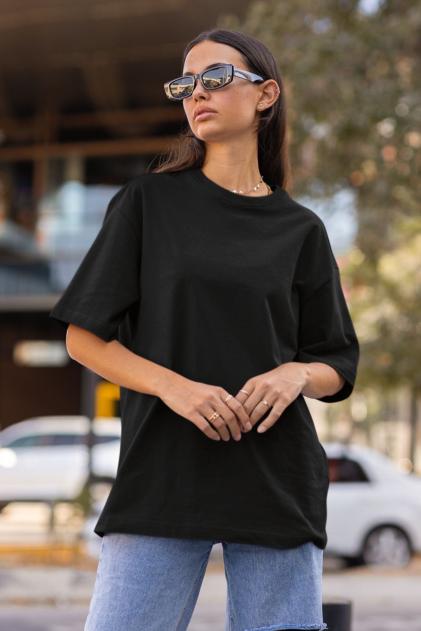 First front view of a female model wearing a black oversized t-shirt featuring Crocodile, the Desiccation Master, from the One Piece anime.