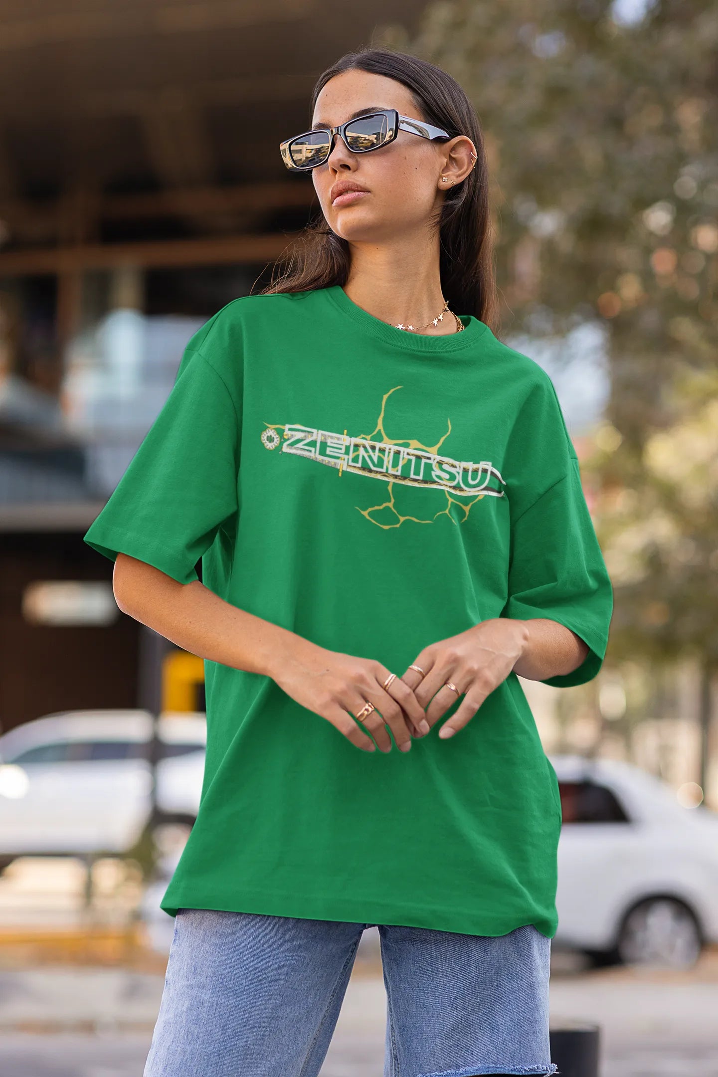 2nd front view of a female model wearing a forest green oversized t-shirt featuring Zenitsu Agatsuma with the text "High Voltage".