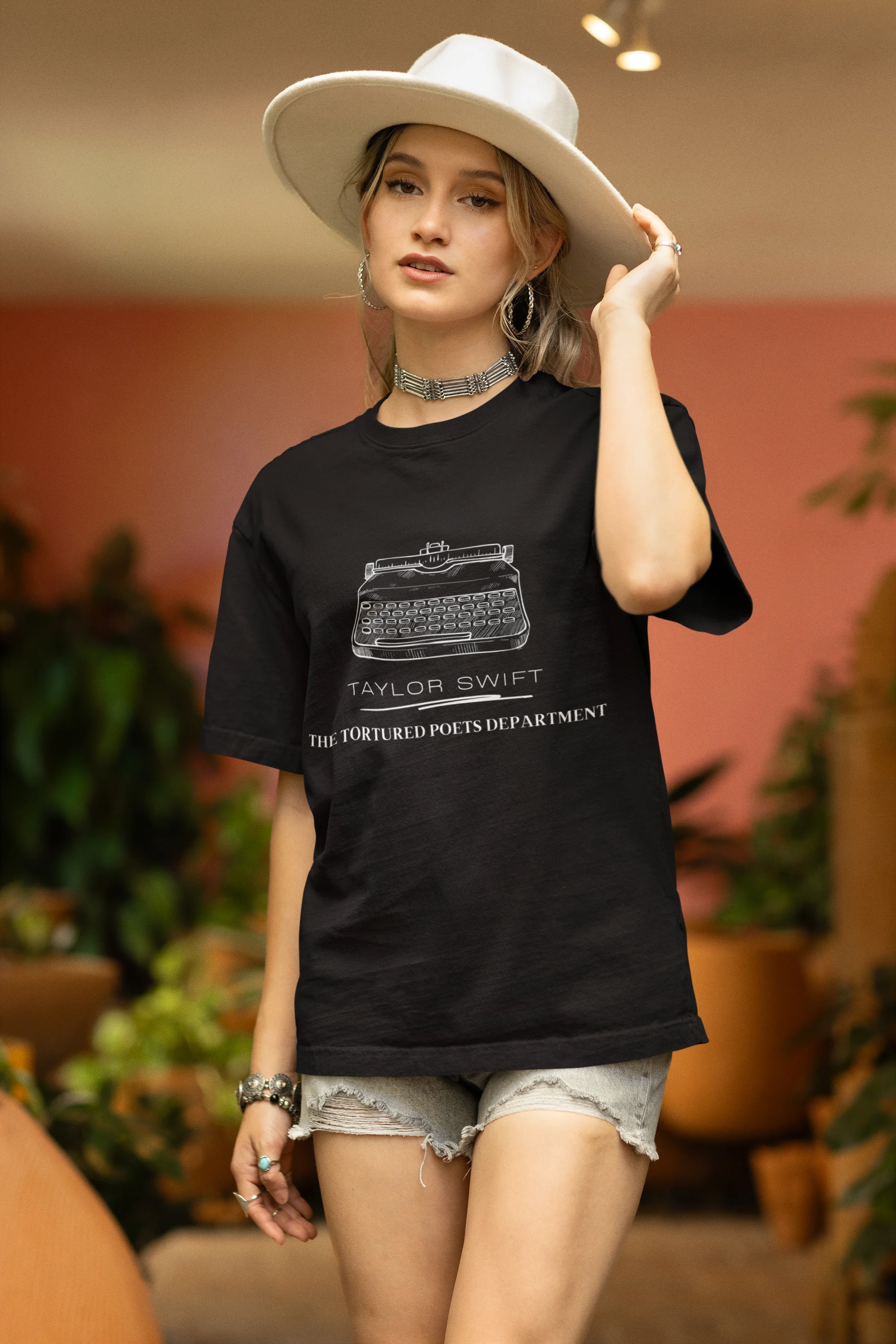 Second image of woman wearing TTPD-inspired black oversize t-shirt TTPD collection tees, embodying Taylor Swift's unique Swiftie aesthetic.