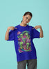 Third front view of a female model wearing a royal blue oversized t-shirt with a psychedelic design featuring green aliens and spaceships, perfect for a hippie, trance, or groovy style.