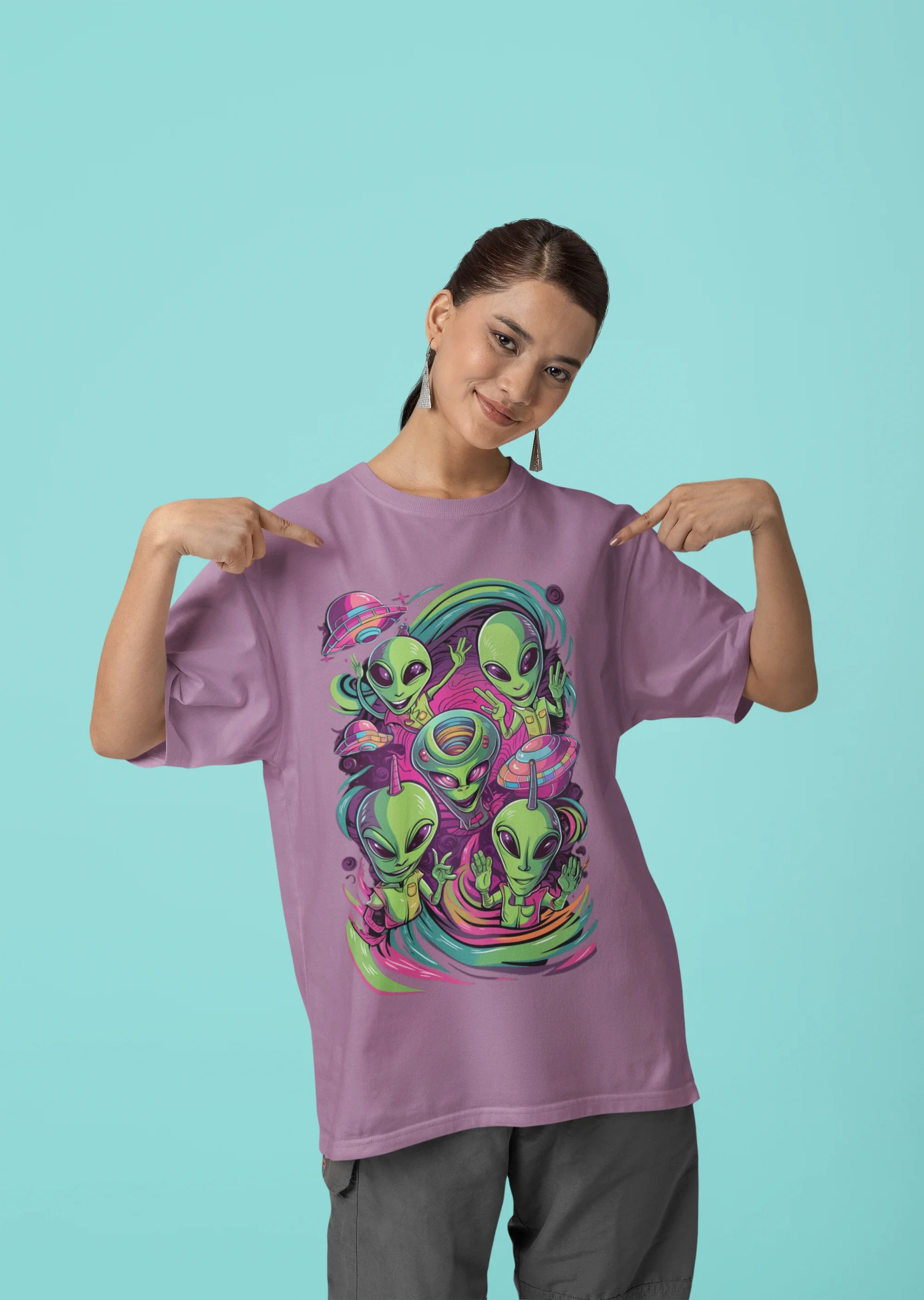 Third front view of a female model wearing a dirty purple oversized t-shirt with a psychedelic design featuring green aliens and spaceships, perfect for a hippie, trance, or groovy style.