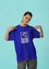 First front view of a female model wearing a royal blue oversized t-shirt featuring a design inspired by Alessia Cara's song 