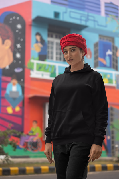 First front view of a female model wearing a black hoodie with Diljit holding up a sunflower with the text "Dil Jeet" in the background.