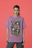 Second front view of a female model wearing a dirty purple oversized t-shirt with a psychedelic design featuring green aliens and spaceships, perfect for a hippie, trance, or groovy style.