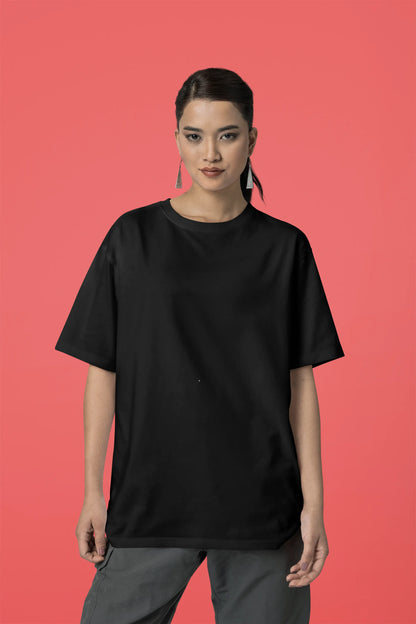 Front view of a female model wearing a black oversized t-shirt with a punk techno angel design, perfect for rave and party wear.