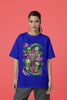 Second front view of a female model wearing a royal blue oversized t-shirt with a psychedelic design featuring green aliens and spaceships, perfect for a hippie, trance, or groovy style.