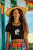 Third front view of a female model wearing a black crop top with a baby angel design and 