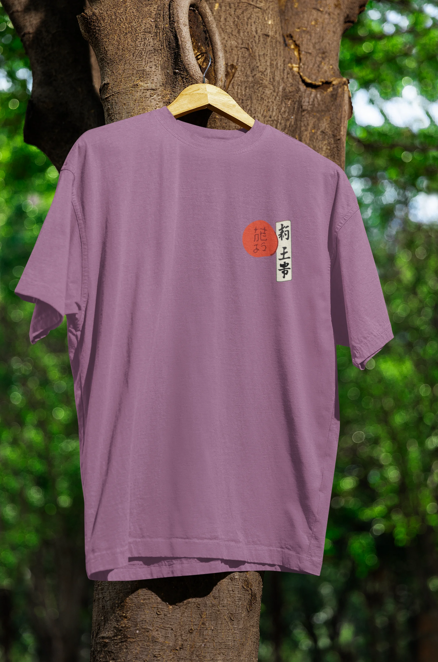 Front view of a dirty purple oversized tee with a design of a wolf surveying a Japanese landscape.