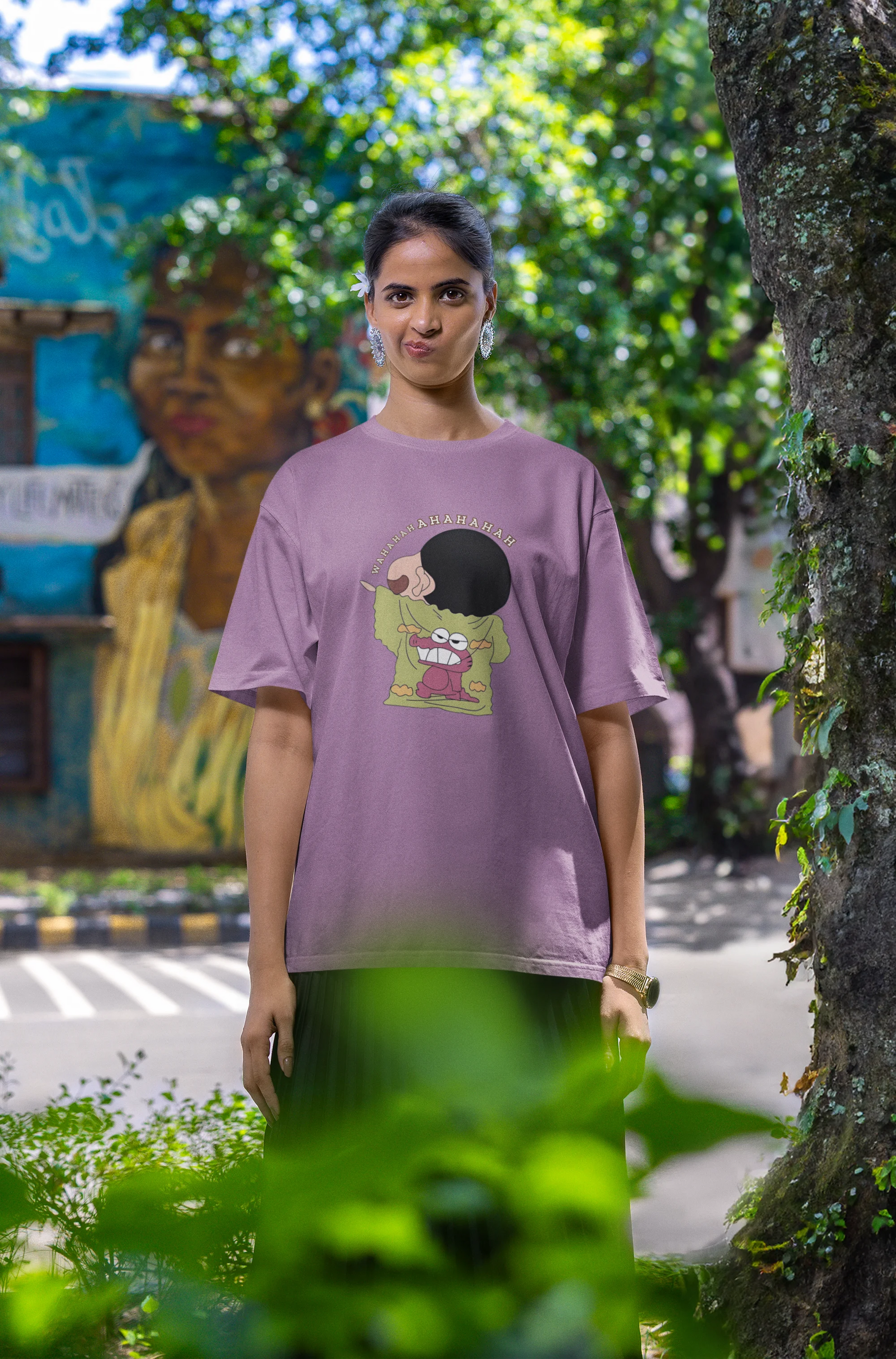 Fourth front view of female model wearing a dirty purple oversized t-shirt with a design of Shinchan laughing hysterically. Perfect for Shinchan fans who love the character's humor.