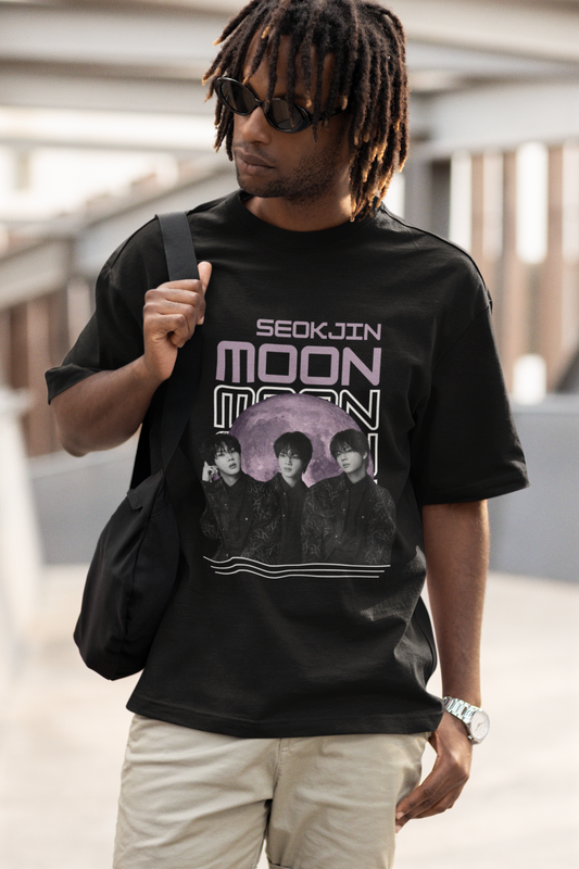 Front view of male model wearing an oversized black t-shirt featuring a unique design inspired by BTS member Jin, also known as "Worldwide Handsome." Ideal for fans of BTS and K-Pop music enthusiasts in general.