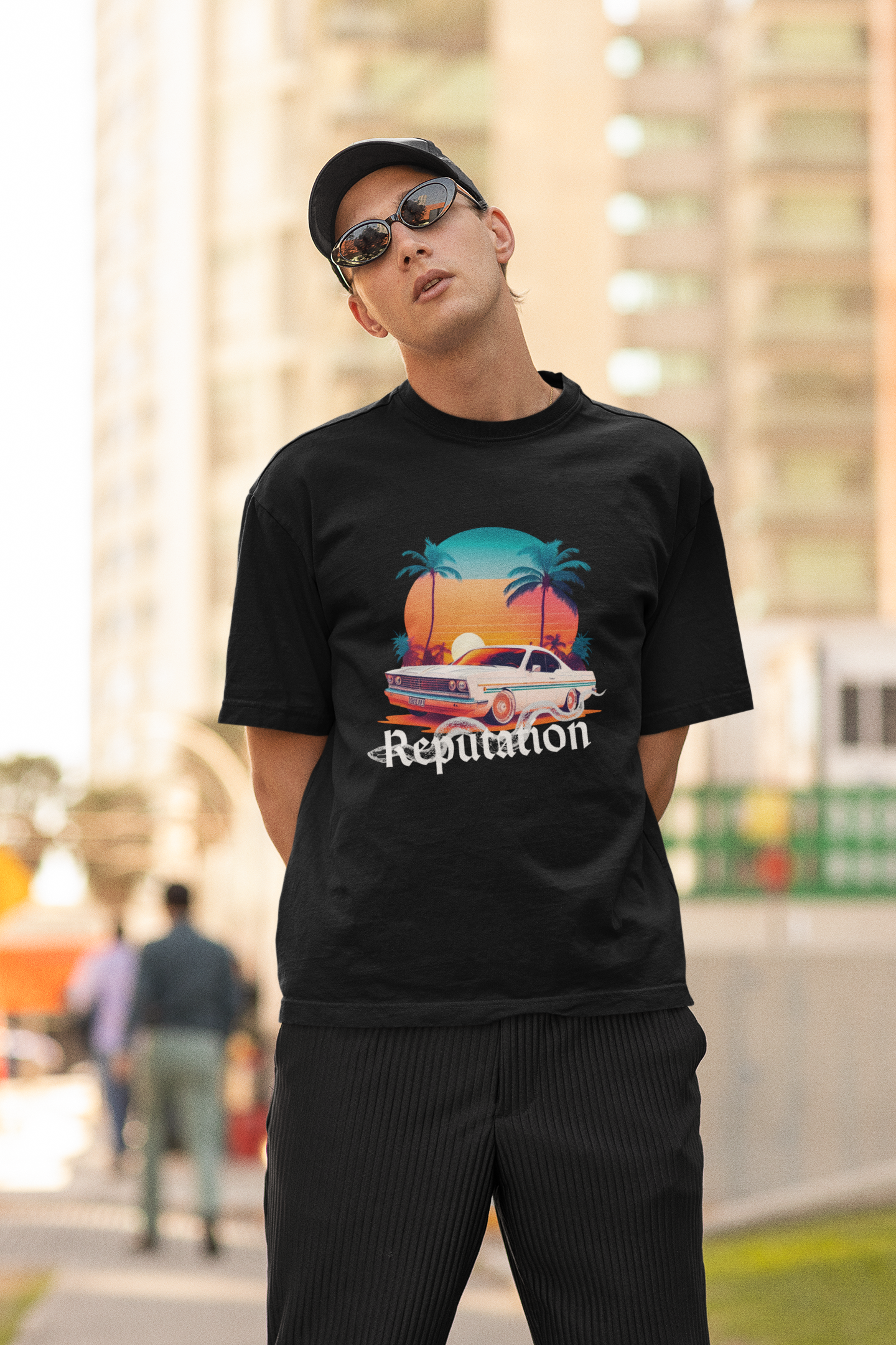 Second image of man wearing black Oversize t-shirt featuring Reputation Taylor's Version design inspired by Taylor Swift's Reputation era