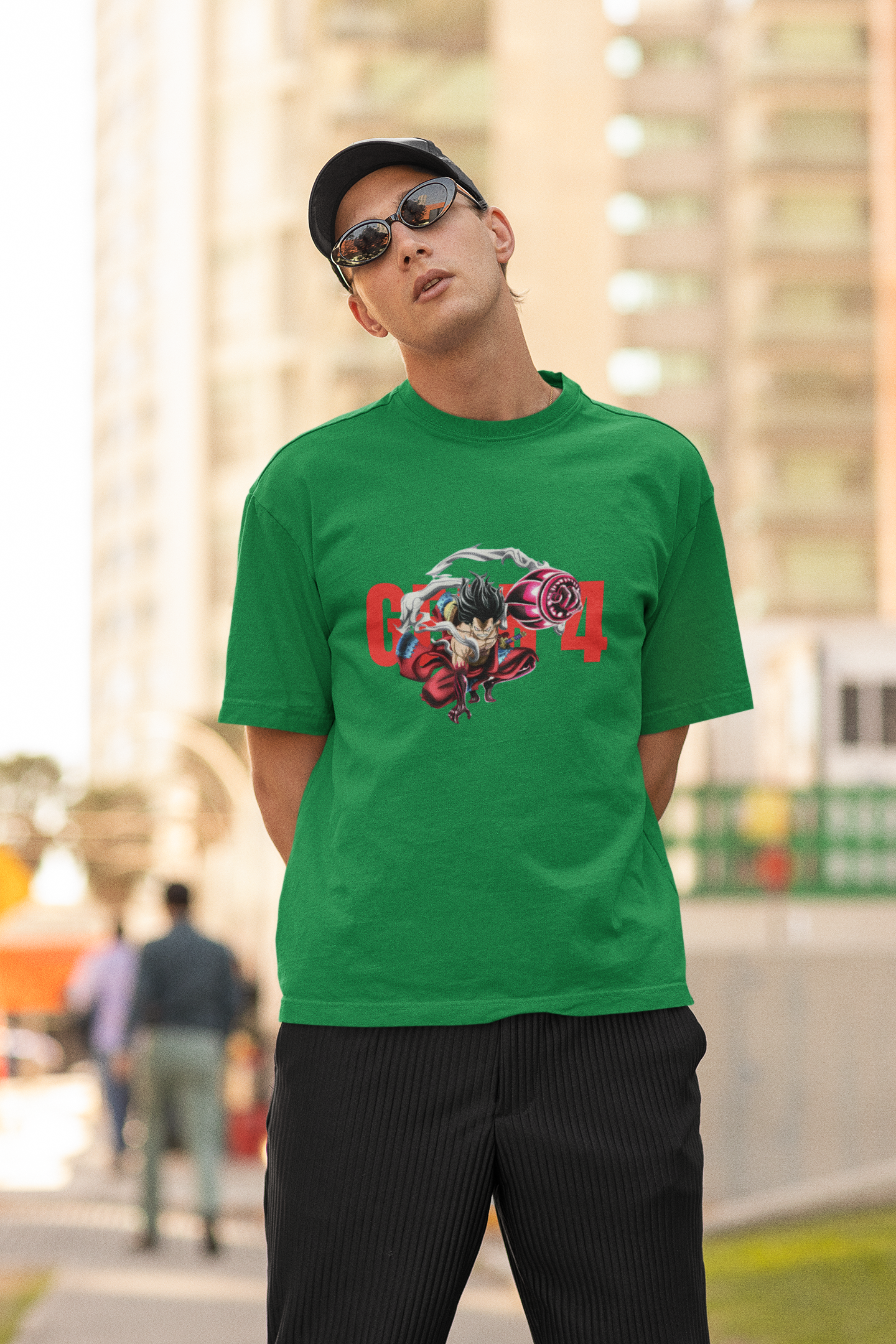 2nd front view of a male model wearing a forest green oversized t-shirt featuring Luffy in his Gear 4 Bounceman form from the One Piece anime.