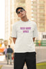 First front view image of a male model wearing a white oversized t-shirt with a bold graphic that reads 