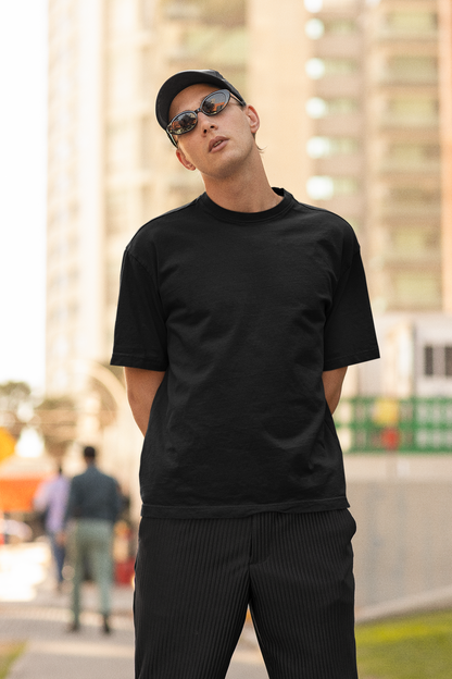 2nd front view of a male model wearing a black oversized t-shirt featuring Crocodile, the Desiccation Master, from the One Piece anime.