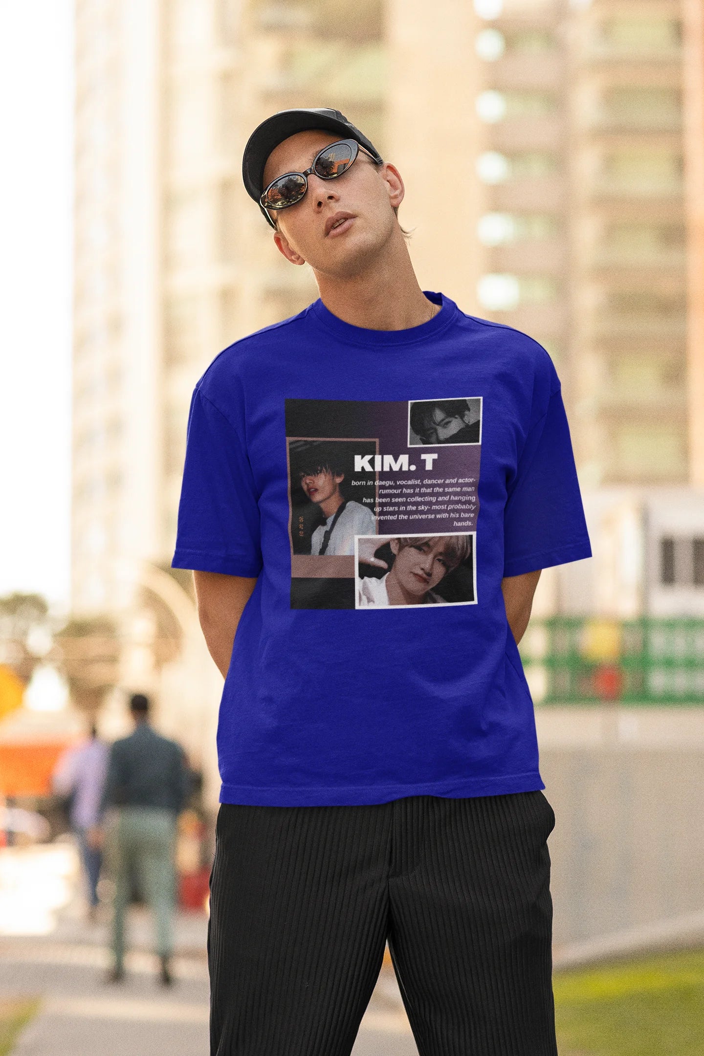 Second front view of male model wearing a royal blue oversized t-shirt featuring a bold design inspired by BTS member Kim Taehyung (V). Ideal for BTS fans (ARMY) and K-Pop enthusiasts.