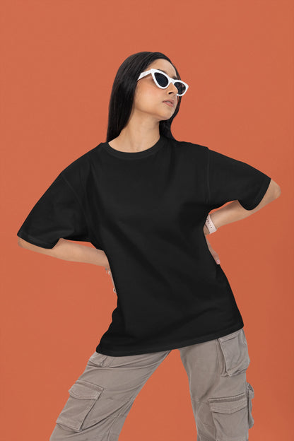 3rd front view of a female model wearing a black oversized t-shirt featuring a couple dancing in the moonlight, inspired by Ed Sheeran's themes of love.