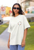 Front view of woman wearing white Oversized T-shirt featuring Taylor Swift Midnight design