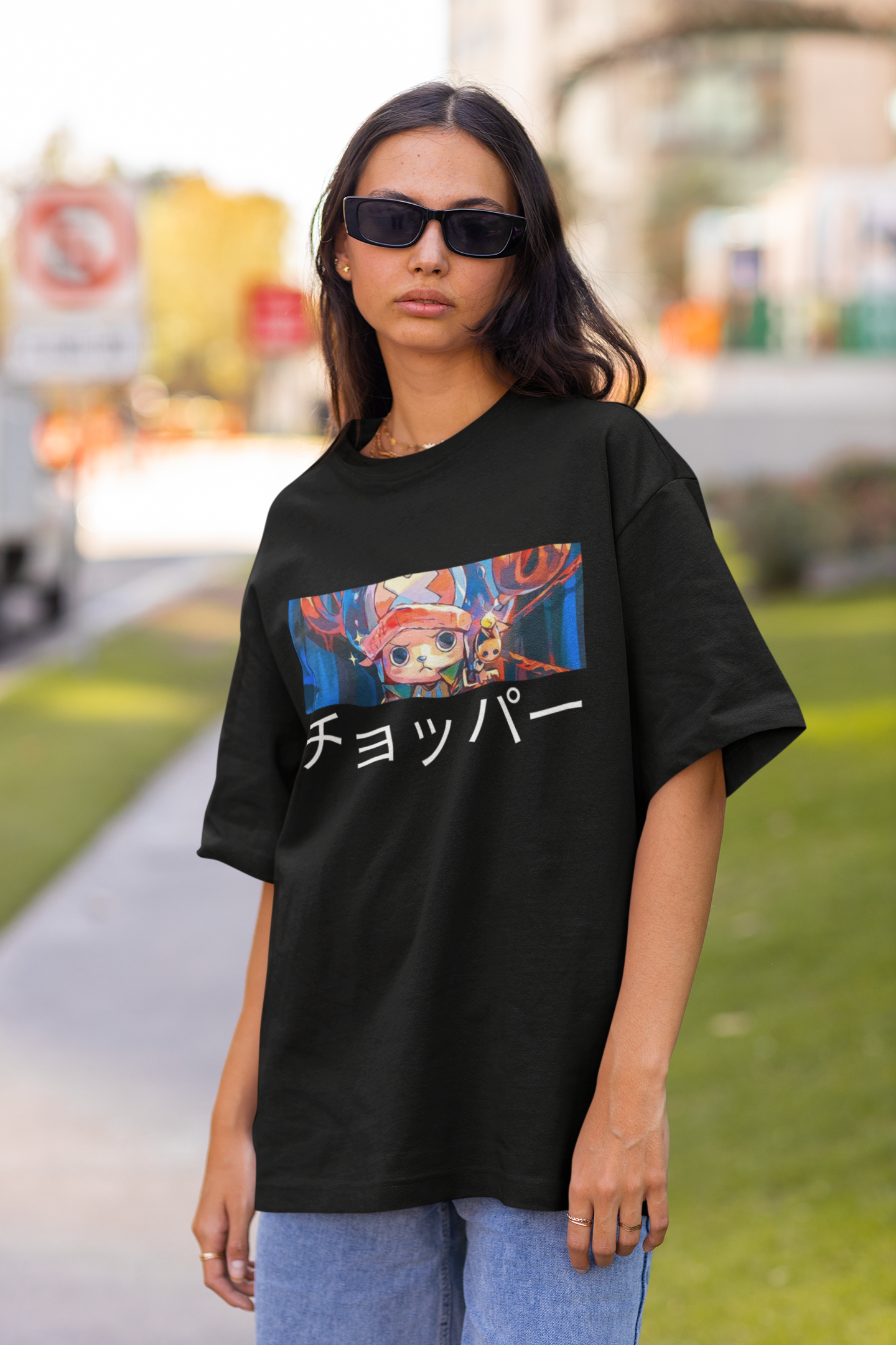 3rd front view a female model wearing a black oversized t-shirt featuring Tony Chopper from the One Piece anime.