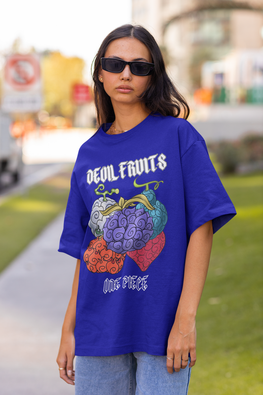 2nd front view of a female model wearing a royal blue oversized t-shirt featuring a design of a Devil Fruit from the One Piece anime.