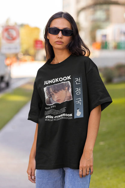 Front view of a female model wearing a black oversized t-shirt featuring a vibrant design inspired by BTS member Jungkook. Ideal for fans of BTS and K-Pop music in general.