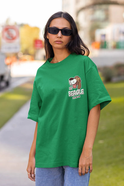 Front view of female Model showcasing forest green oversized tee with a The Beagles animated series themed design, featuring the cool canine quartet from ourt disney collection of oversized tees.