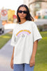 Front view of female model wearing an off-white oversized t-shirt with the hilarious message 