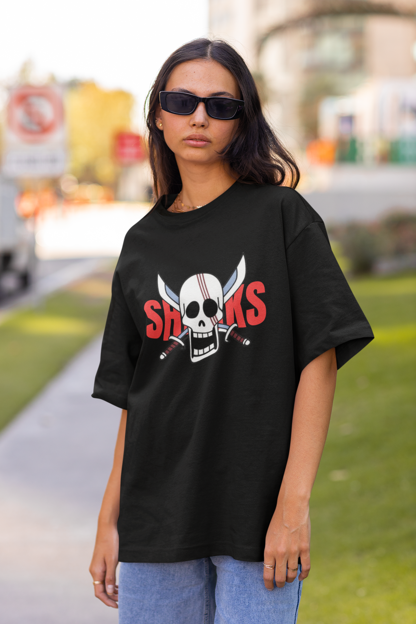 2nd front view of a female model wearing a black oversized t-shirt featuring Red-Haired Shanks from the One Piece anime.