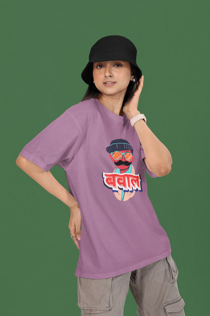 First front view of a female model wearing a dirty purple oversized t-shirt with "Bawaal" in a stylish Hindi.