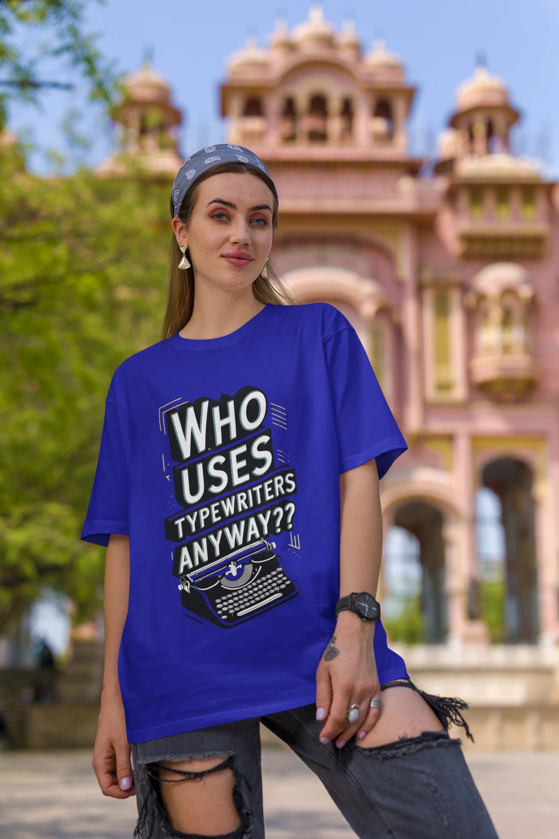 First Image of a woman wearing blue Oversize t-shirt featuring TTPD design inspired by Taylor Swift's Eras Tour.