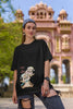 First image of female model wearing black oversized tee with a Disney's Chip and Dale design, featuring the adorable duo in a playful scene.