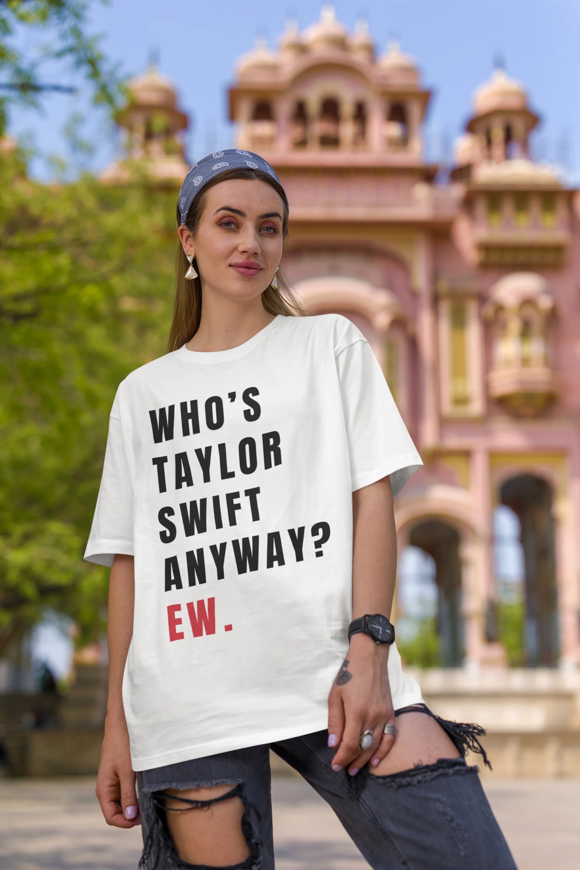 Third image of Woman wearing Taylor Swift Red-themed oversized tee, showcasing iconic eras tour merch and Taylor's Version nod
