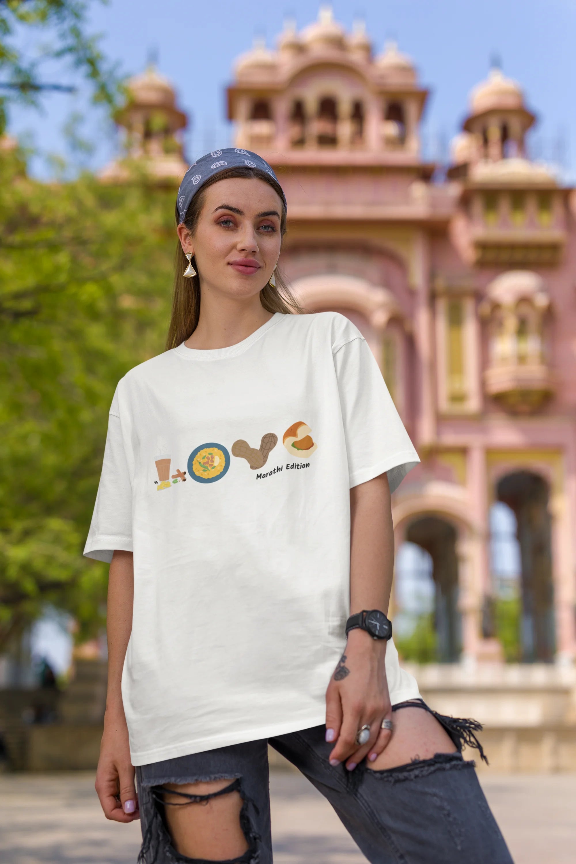 First front view of a female model wearing an off-white oversized t-shirt with a colorful design that celebrates Marathi culture. Ideal for anyone who loves Maharashtra and its vibrant heritage.