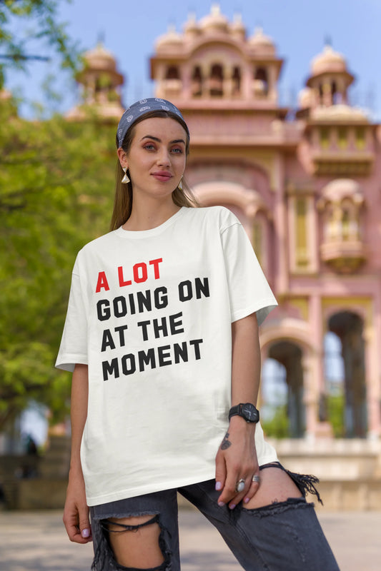First image of Woman wearing Taylor Swift Red-themed half sleeve tee, showcasing iconic eras tour merch and Taylor's Version nod
