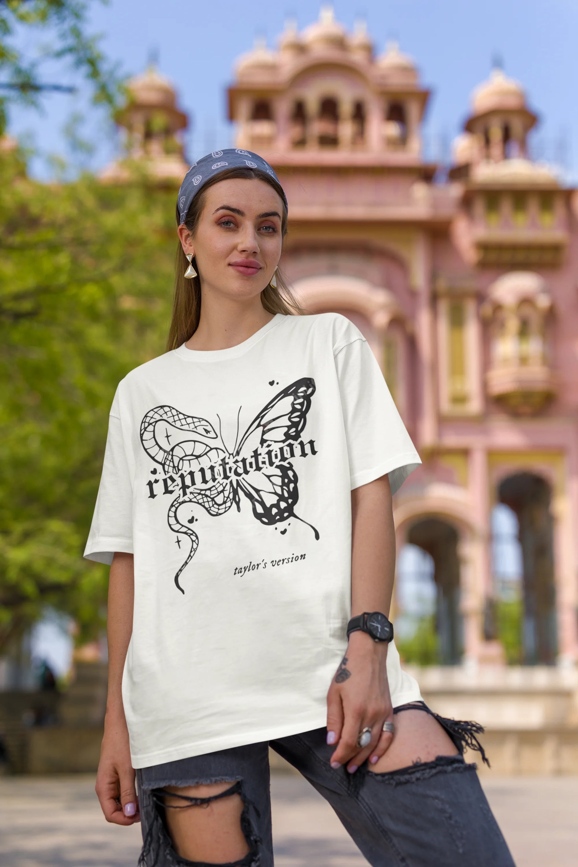 Second Image of woman wearing white Oversize t-shirt featuring Reputation Taylor's Version design inspired by Taylor Swift's Reputation era