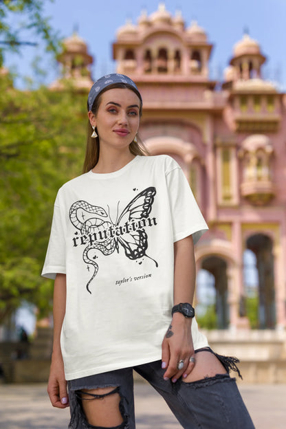 Second Image of woman wearing white Oversize t-shirt featuring Reputation Taylor's Version design inspired by Taylor Swift's Reputation era