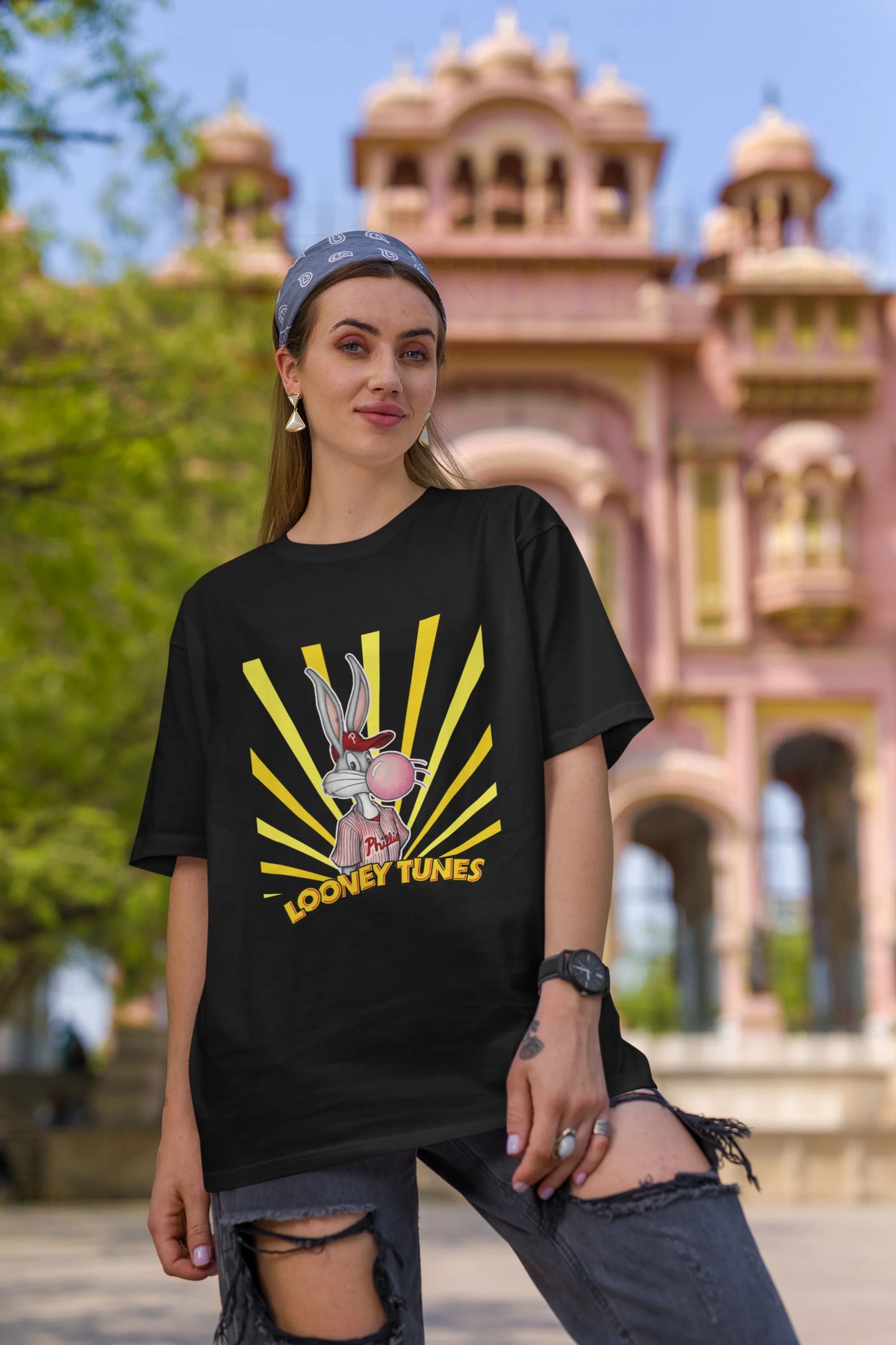 First image of female Model showcasing black Bugs Bunny oversize t-shirt from Looney Tunes, featuring a bold Bugs Bunny design