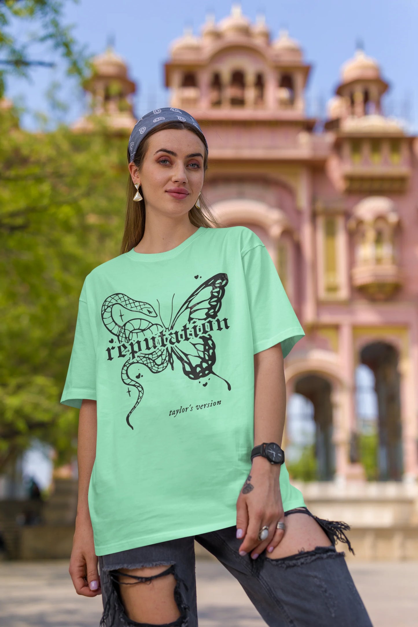 Second Image of woman wearing mint green Oversize t-shirt featuring Reputation Taylor's Version design inspired by Taylor Swift's Reputation era